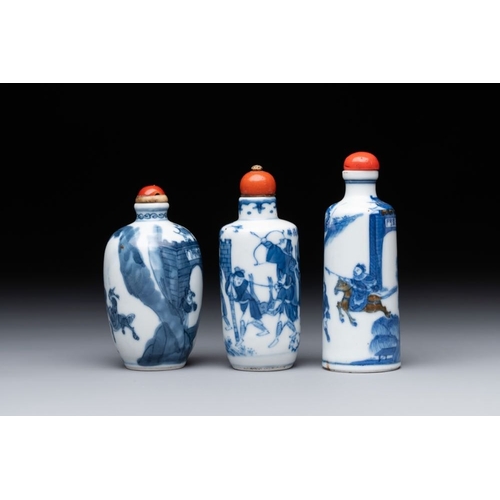 18 - Two Chinese blue and white snuff bottles and a blue, white and copper-red snuff bottle, Yongzheng ma... 