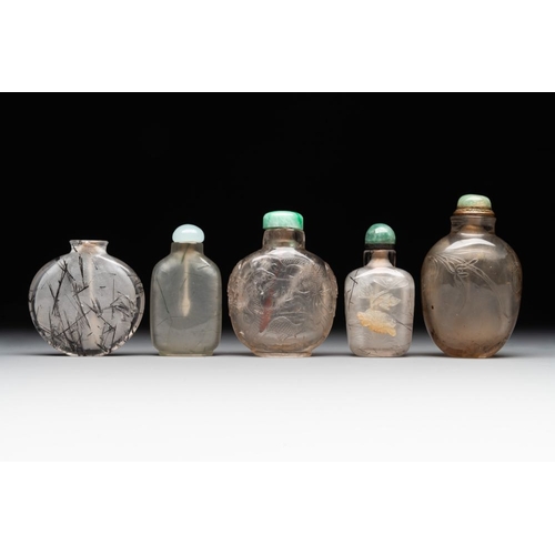 48 - Five Chinese rock crystal and needle agate snuff bottles, QingH.: 8,5 cm (the tallest incl. stopper)... 