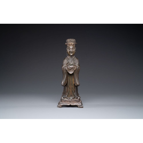 141 - A Chinese bronze figure of an official, MingH.: 29 cmThe absence of a condition report does not impl... 