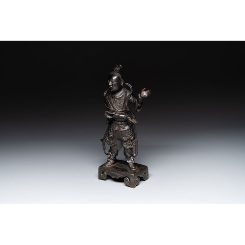 143 - A fine Chinese bronze figure of a divinity, MingH.: 31 cm Weight: 2127 grams The absence of a condit... 