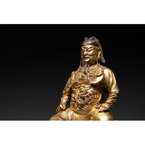 144 - An extremely rare Chinese gilt bronze figure of Guandi, MingH.: 37,8 cm (incl. stand)H.: 33,6 cm (ex... 