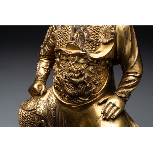 144 - An extremely rare Chinese gilt bronze figure of Guandi, MingH.: 37,8 cm (incl. stand)H.: 33,6 cm (ex... 