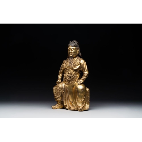 144 - An extremely rare Chinese gilt bronze figure of Guandi, MingH.: 37,8 cm (incl. stand)H.: 33,6 cm (ex... 