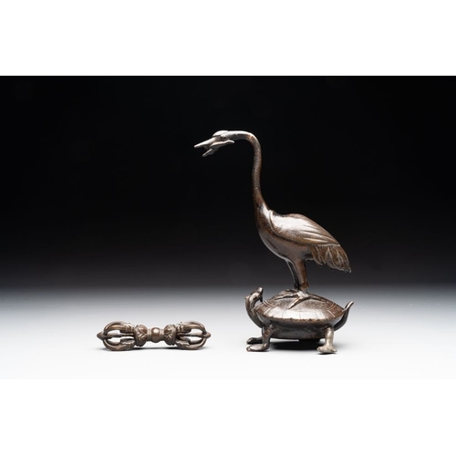 150 - A Chinese bronze candle or incense holder in the shape of a crane standing on a turtle and a Tibetan... 