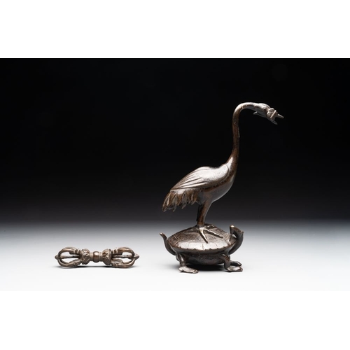 150 - A Chinese bronze candle or incense holder in the shape of a crane standing on a turtle and a Tibetan... 