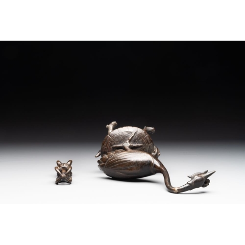 150 - A Chinese bronze candle or incense holder in the shape of a crane standing on a turtle and a Tibetan... 