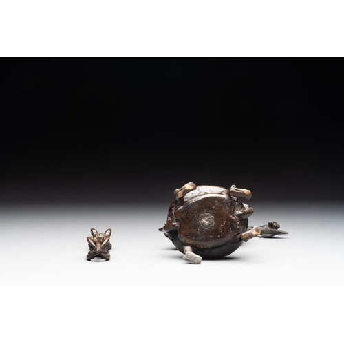 150 - A Chinese bronze candle or incense holder in the shape of a crane standing on a turtle and a Tibetan... 