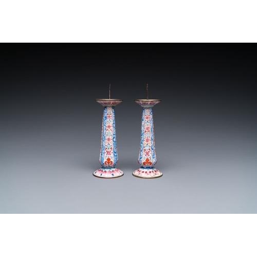 162 - A pair of Chinese Canton enamel candlesticks with floral design, Yongzheng/QianlongH.: 13 cmThe abse... 