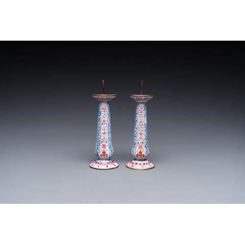 162 - A pair of Chinese Canton enamel candlesticks with floral design, Yongzheng/QianlongH.: 13 cmThe abse... 