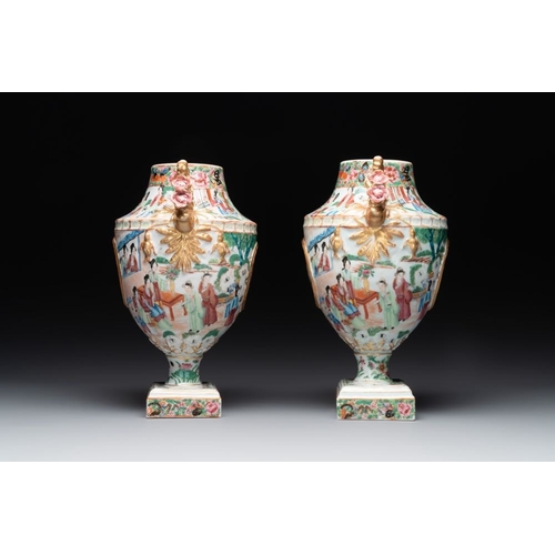 198 - A rare pair of Chinese Canton famille rose export urns, 19th C.H.: 33 cmThe absence of a condition r... 