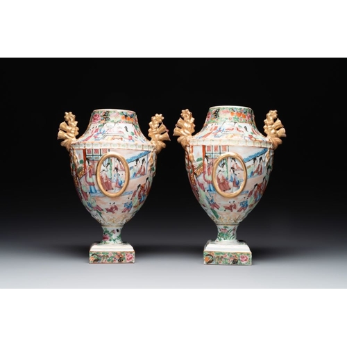 198 - A rare pair of Chinese Canton famille rose export urns, 19th C.H.: 33 cmThe absence of a condition r... 