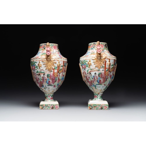 198 - A rare pair of Chinese Canton famille rose export urns, 19th C.H.: 33 cmThe absence of a condition r... 