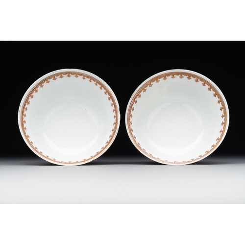 218 - A pair of Chinese armorial famille rose cups and saucers with the arms of Tyndall for the English ma... 