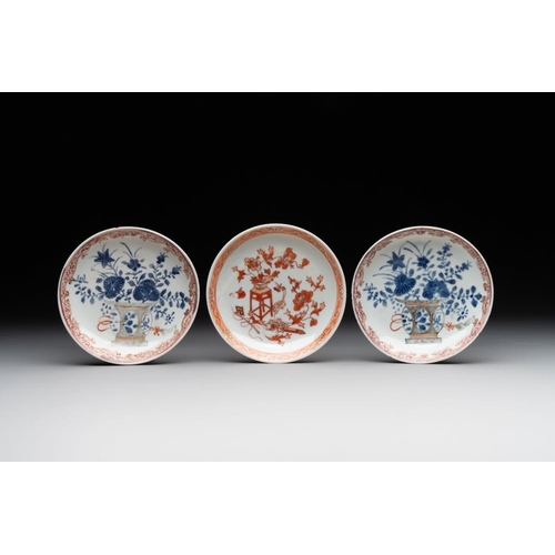 243 - A pair of Chinese polychrome-decorated cups and saucers and an iron-red gilt-decorated cup and sauce... 