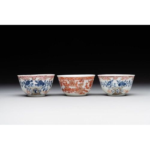 243 - A pair of Chinese polychrome-decorated cups and saucers and an iron-red gilt-decorated cup and sauce... 