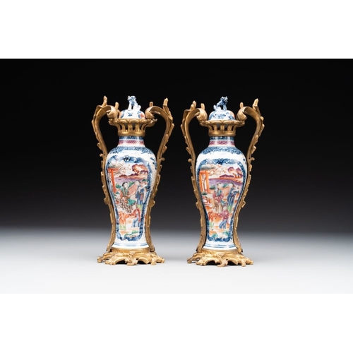 270 - A pair of Chinese Canton famille rose 'mandarin subject' vases with gilt bronze mounts, QianlongH.: ... 