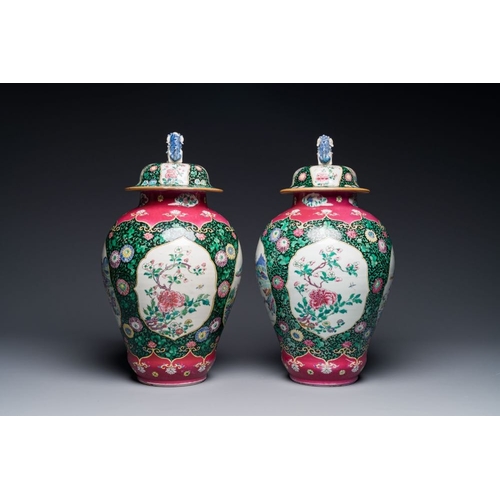 304 - A pair of Chinese famille rose black-ground jars and covers with mountainous landscape design, Yongz... 