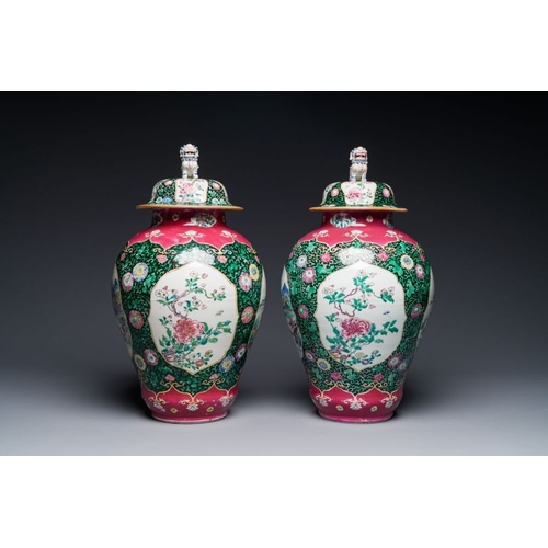 304 - A pair of Chinese famille rose black-ground jars and covers with mountainous landscape design, Yongz... 