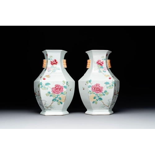 308 - A pair of hexagonal Chinese famille rose 'hu' vases with floral design, Qianlong/JiaqingH.: 34,6 cmT... 