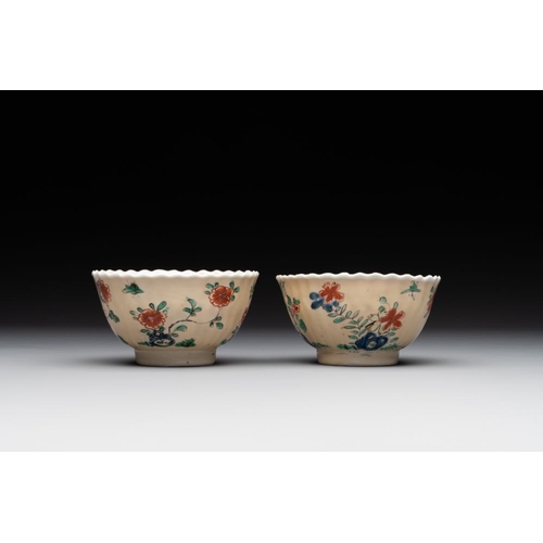 343 - A pair of Chinese famille verte cafe-au-lait-ground cups and saucers, KangxiDia.: 13 cm (the saucers... 