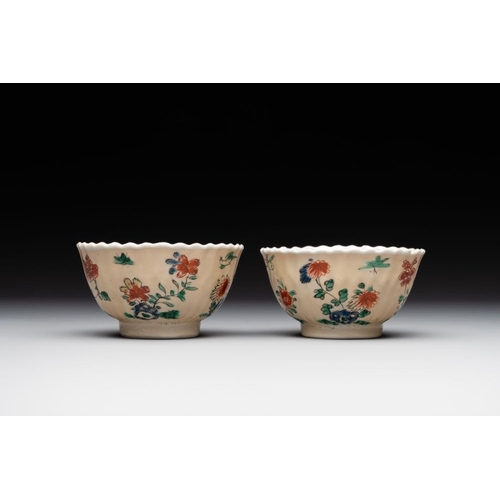 343 - A pair of Chinese famille verte cafe-au-lait-ground cups and saucers, KangxiDia.: 13 cm (the saucers... 