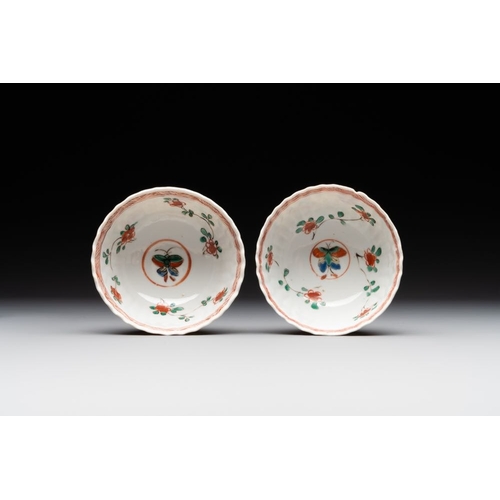 343 - A pair of Chinese famille verte cafe-au-lait-ground cups and saucers, KangxiDia.: 13 cm (the saucers... 