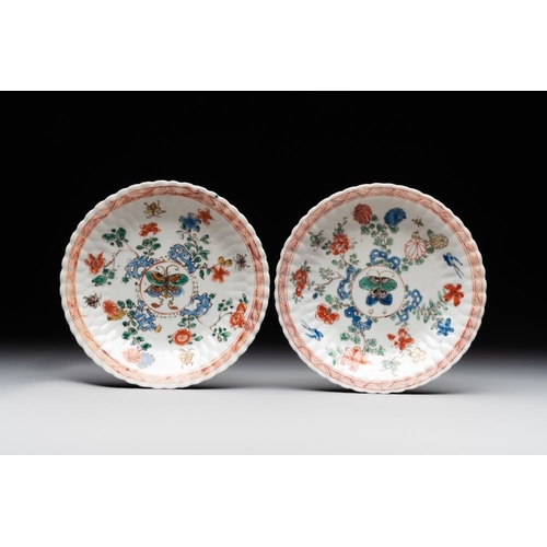 343 - A pair of Chinese famille verte cafe-au-lait-ground cups and saucers, KangxiDia.: 13 cm (the saucers... 