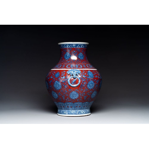 354 - A Chinese blue and white, and iron-red 'bajixiang' 'hu' vase on wooden stand, Qianlong mark, 19th C.... 