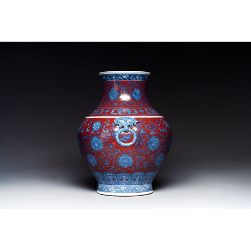 354 - A Chinese blue and white, and iron-red 'bajixiang' 'hu' vase on wooden stand, Qianlong mark, 19th C.... 