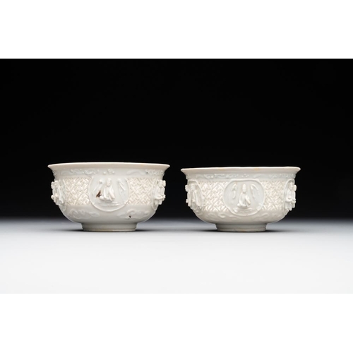 392 - A pair of rare Chinese reticulated white-glazed biscuit 'Eight Immortals and Shoulao' bowls, WanliDi... 