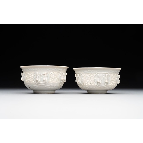 392 - A pair of rare Chinese reticulated white-glazed biscuit 'Eight Immortals and Shoulao' bowls, WanliDi... 