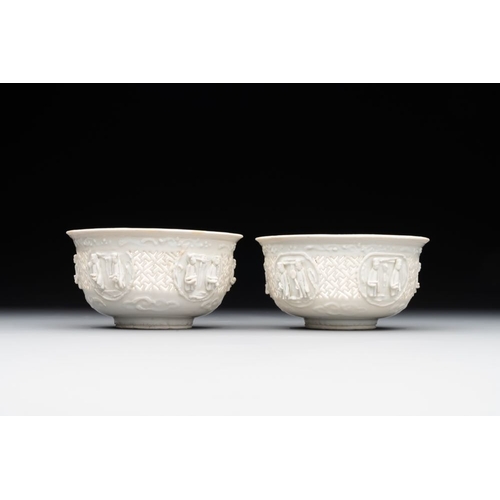 392 - A pair of rare Chinese reticulated white-glazed biscuit 'Eight Immortals and Shoulao' bowls, WanliDi... 