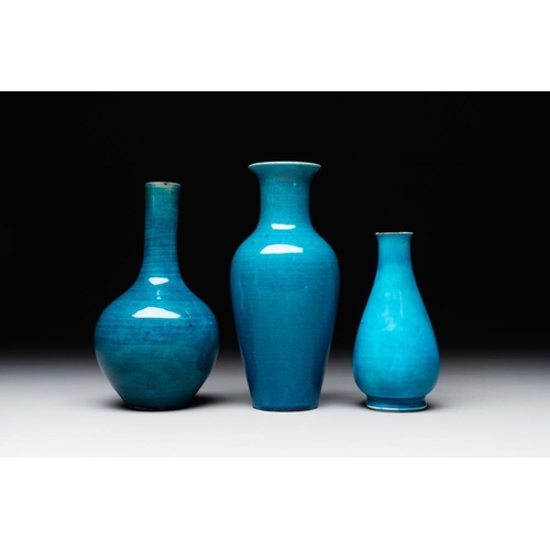 395 - Three Chinese monochrome turquoise-glazed vases with two wooden stands, Kangxi and laterH.: 16,3 (th... 