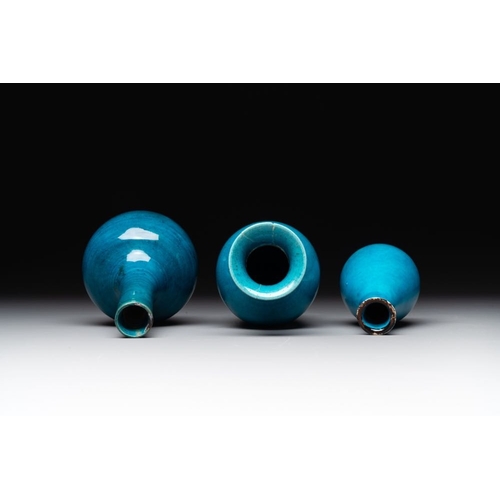 395 - Three Chinese monochrome turquoise-glazed vases with two wooden stands, Kangxi and laterH.: 16,3 (th... 