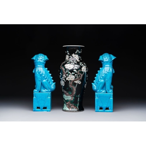 398 - A Chinese famille verte black-ground vase and a pair of turquoise-glazed Buddhist lions, 19/20th C.H... 