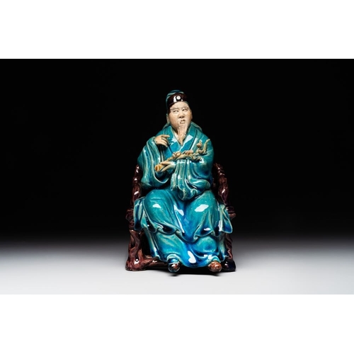 399 - A Chinese turquoise- and aubergine-glazed sculpture of a seated scholar, 18/19th C.Dim.: 10 x 12 x 1... 