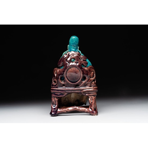 399 - A Chinese turquoise- and aubergine-glazed sculpture of a seated scholar, 18/19th C.Dim.: 10 x 12 x 1... 