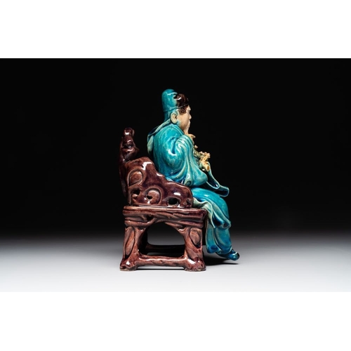 399 - A Chinese turquoise- and aubergine-glazed sculpture of a seated scholar, 18/19th C.Dim.: 10 x 12 x 1... 