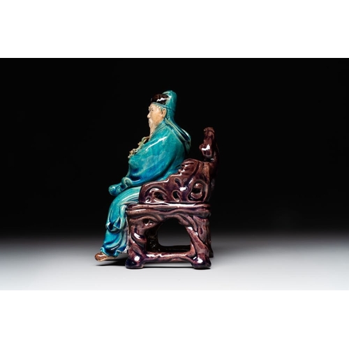 399 - A Chinese turquoise- and aubergine-glazed sculpture of a seated scholar, 18/19th C.Dim.: 10 x 12 x 1... 