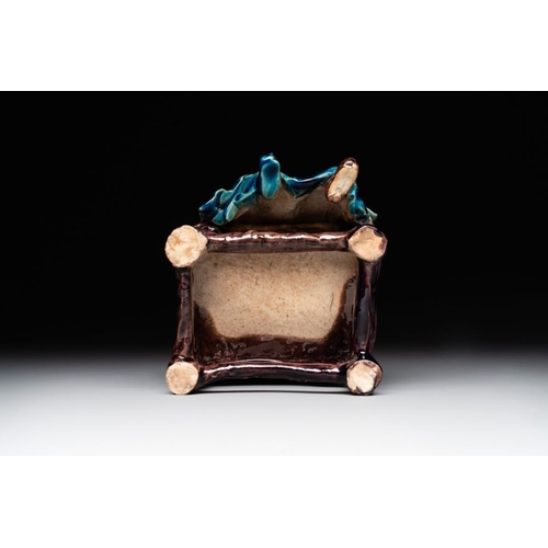 399 - A Chinese turquoise- and aubergine-glazed sculpture of a seated scholar, 18/19th C.Dim.: 10 x 12 x 1... 