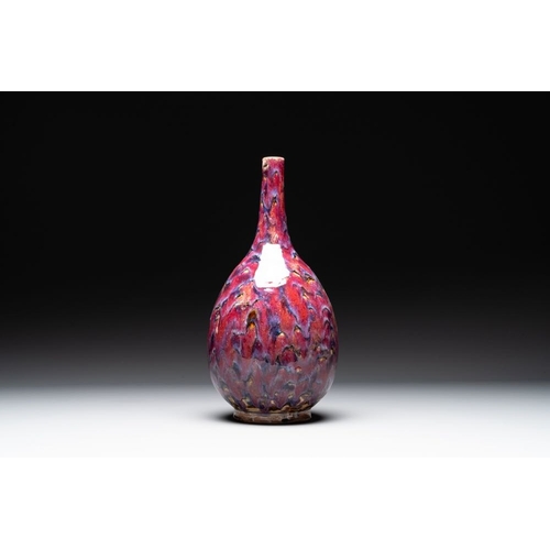 405 - A Chinese flambe-glazed bottle vase, 19th C.H.: 44 cmThe absence of a condition report does not impl... 