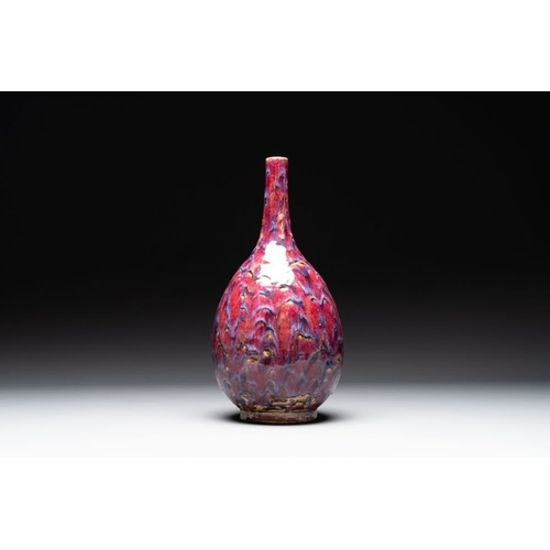 405 - A Chinese flambe-glazed bottle vase, 19th C.H.: 44 cmThe absence of a condition report does not impl... 