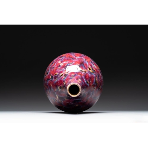 405 - A Chinese flambe-glazed bottle vase, 19th C.H.: 44 cmThe absence of a condition report does not impl... 