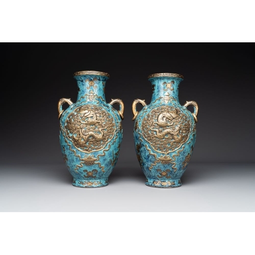 414 - A pair of Chinese robin's egg and faux bronze-glazed 'hu' vases, Qianlong mark, 19th C.H.: 37,8 cmTh... 