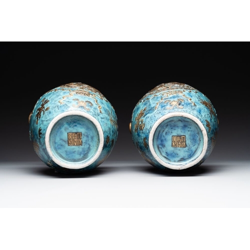 414 - A pair of Chinese robin's egg and faux bronze-glazed 'hu' vases, Qianlong mark, 19th C.H.: 37,8 cmTh... 