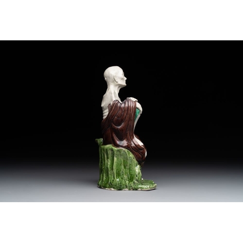 422 - A fine Chinese sancai-glazed figure of a Luohan, QianlongH.: 24,5 cmThe absence of a condition repor... 