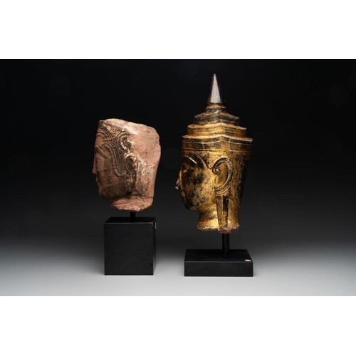 452 - A Thai red sandstone head of Buddha and a lacquered and gilt stone head of Buddha, possibly Ayutthay... 