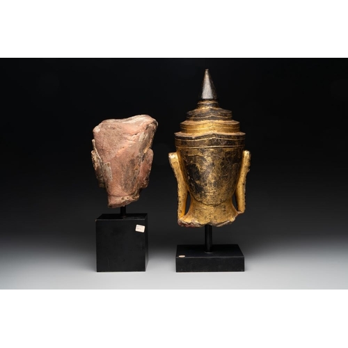 452 - A Thai red sandstone head of Buddha and a lacquered and gilt stone head of Buddha, possibly Ayutthay... 