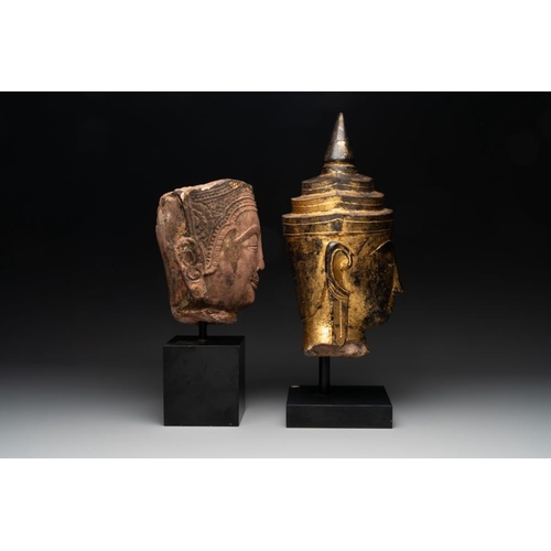 452 - A Thai red sandstone head of Buddha and a lacquered and gilt stone head of Buddha, possibly Ayutthay... 