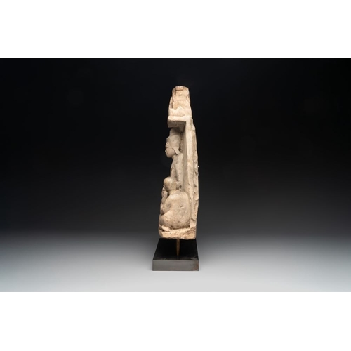 456 - A Burmese limestone stele with Buddha and two attendants with traces of gilding, 19th C.H.: 58 cm (i... 